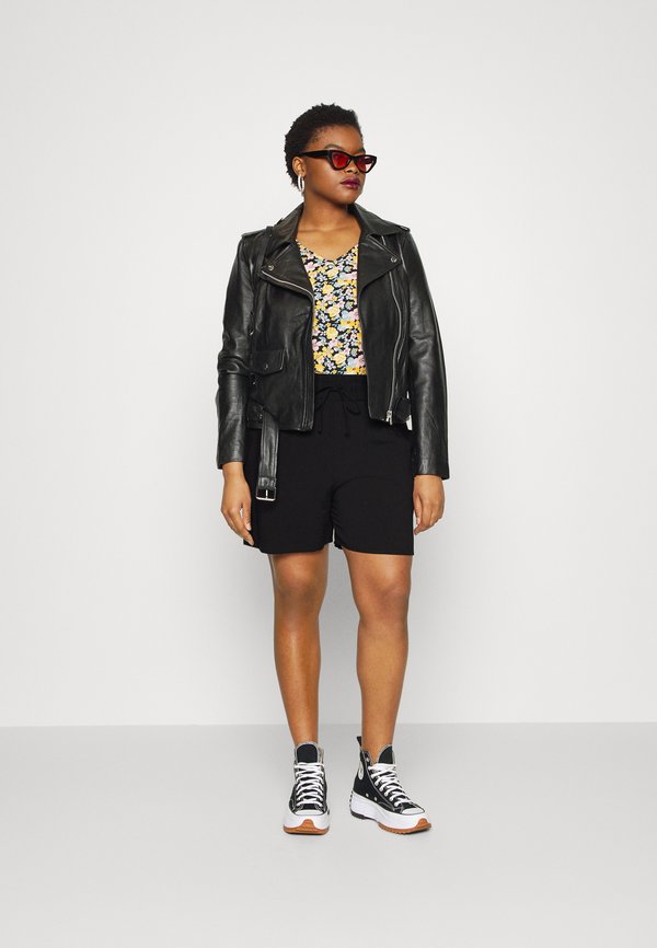 Why a black leather waistcoat is the look for spring
