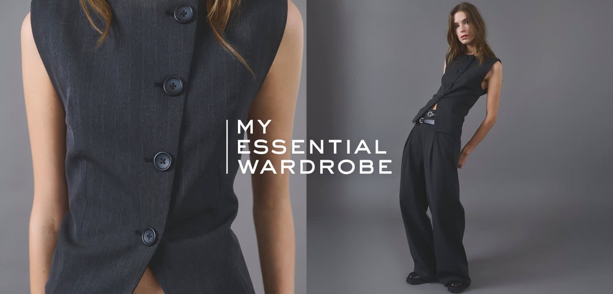 Dunkle Denimweste mit Knöpfen, kombiniert mit lockeren schwarzen Hosen. Verfügt über ein figurbetontes Design mit maßgeschneiderten Details und einem strukturierten Stoff.