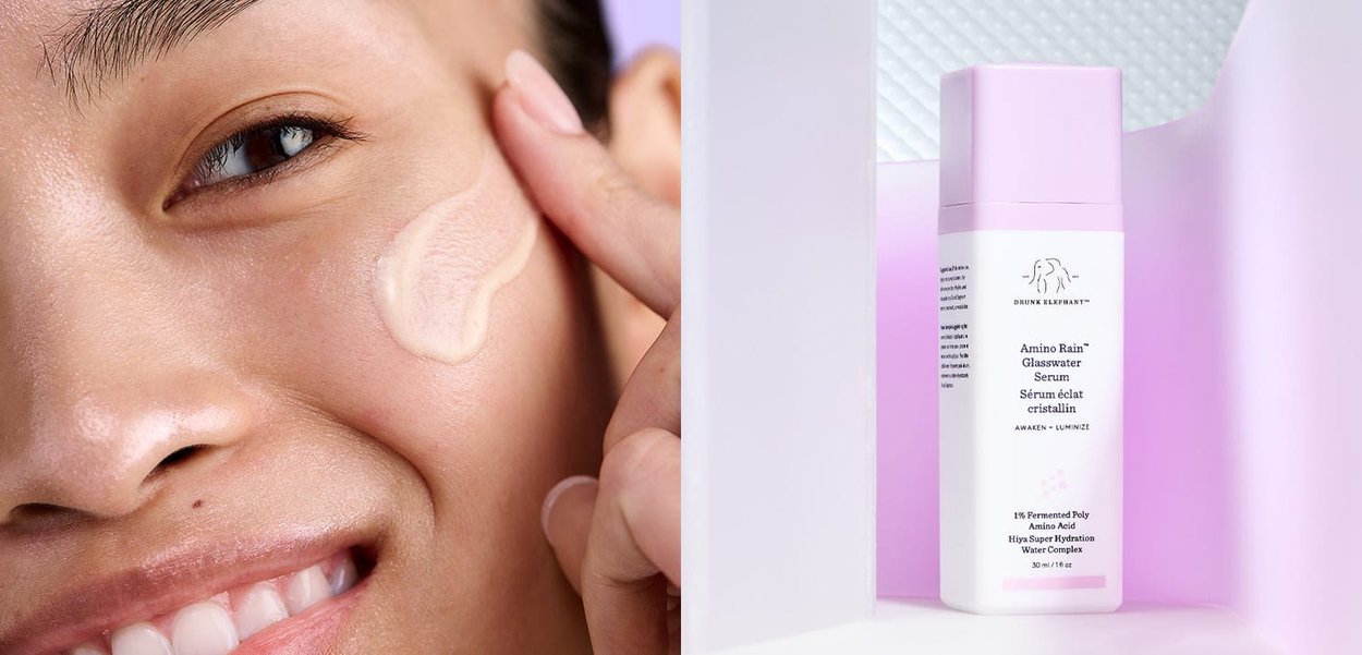 Amino Rain Glasswater Serum in einer zylindrischen weißen Flasche mit einem rosa Deckel, vor einem strukturierten Hintergrund und einem Tropfen Serum auf der Haut.