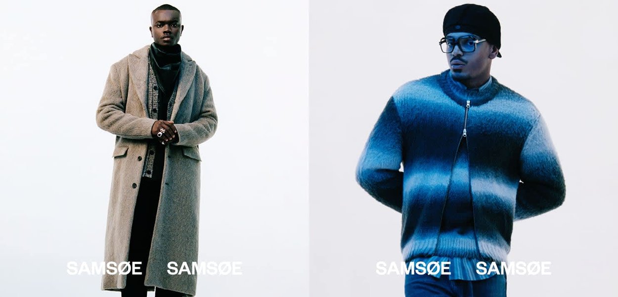 Zwei Models stehen nebeneinander. Links: hellgrauer Wollmantel, geschichtetes schwarzes Outfit, lässige Passform. Rechts: dunkelblaue gestreifte Strickjacke mit Reißverschluss.