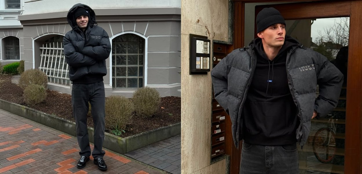 Chaqueta acolchada negra con capucha, detalles en gris y logo; combinada con sudadera negra con capucha y vaqueros oscuros; zapatos negros brillantes; entorno urbano al aire libre.