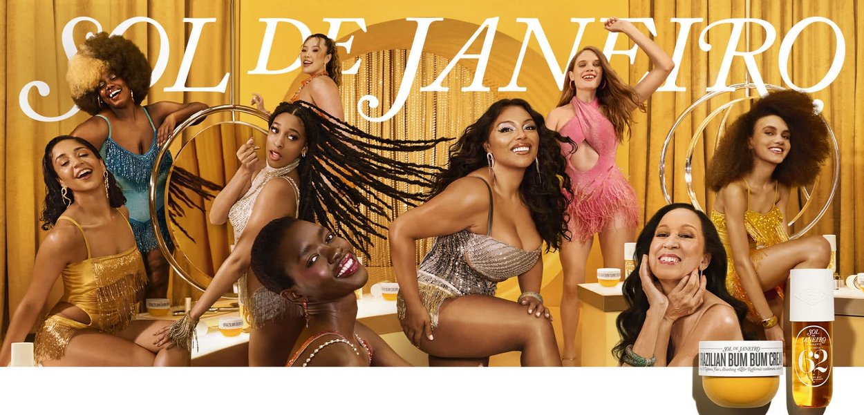 Six individuals in vibrant outfits pose against a yellow backdrop. The products featured are a jar of Brazilian Bum Bum Cream and an oil.