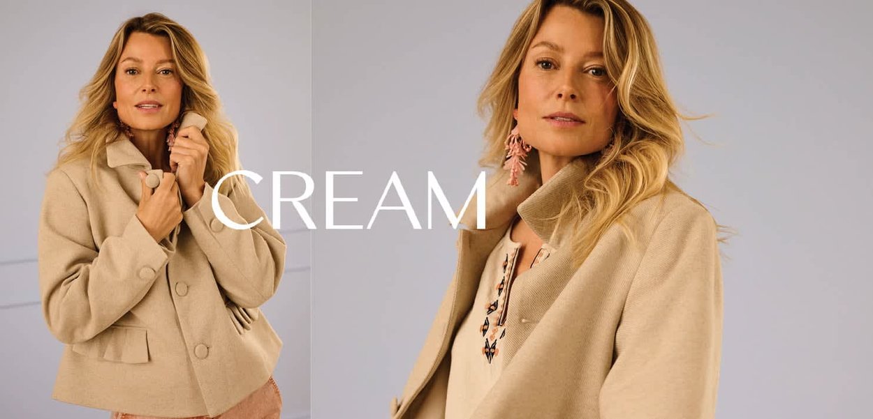 Cremefarbige, kurze Jacke aus strukturiertem Stoff mit großen Knöpfen, einem Mandarinkragen und Seitentaschen.