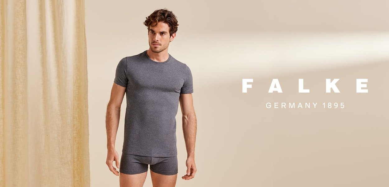 Gray cotton t-shirt and shorts set, short sleeves, round neckline, fitted design, displayed against a neutral background with soft lighting.