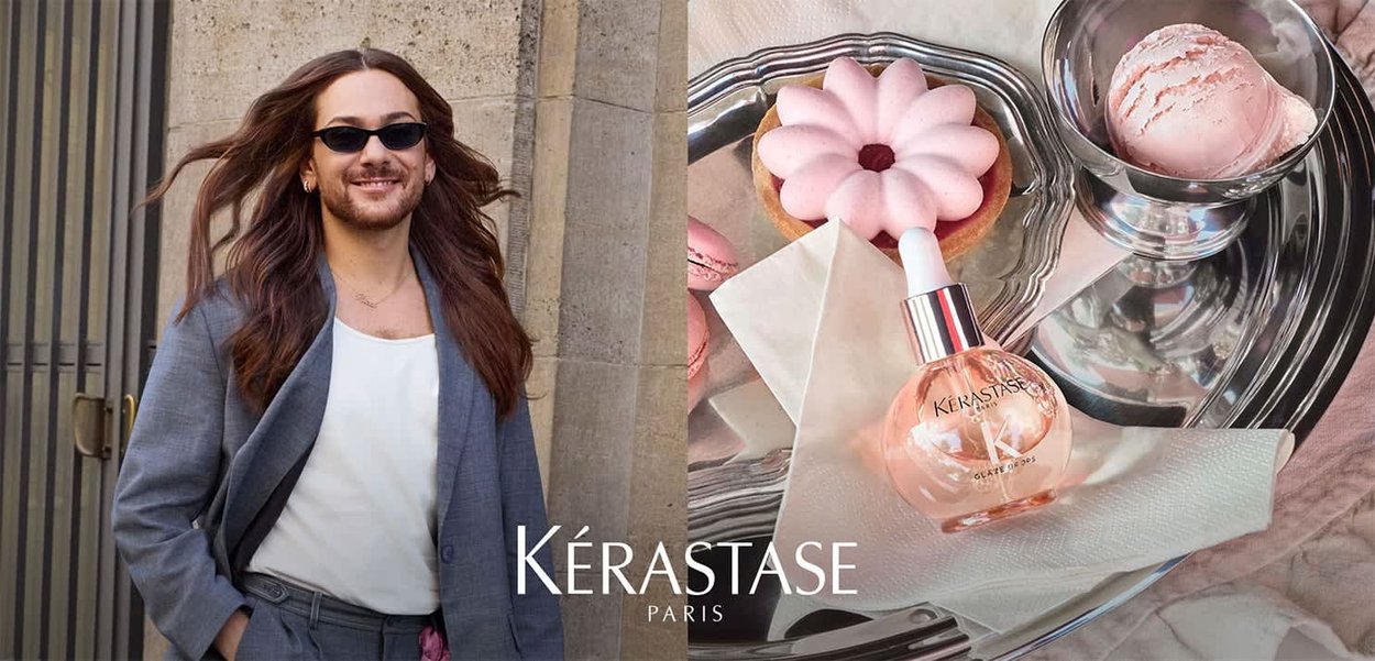 Kérastase Haaröl in einer runden Glasflasche mit silbernem Deckel; rosa Macarons und ein blumiges Dessert sind auf einem spiegelnden Tablett.