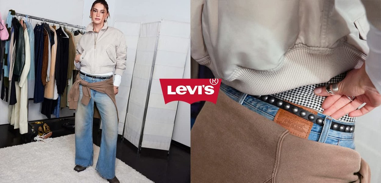 Frau trägt leichte Jacke und Weitbein-Jeans, steht in einem Raum mit einer Kleiderstange; Nahaufnahme eines mit Nieten besetzten Gürtels und Bund der Jeans.