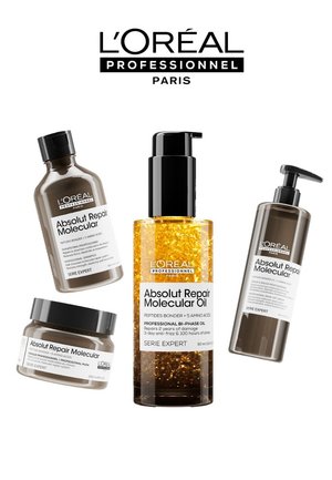 Four hair care products by L'Oréal Professionnel: brown bottle shampoo, thick cream mask, golden bi-phase oil, and tan bottle conditioner.