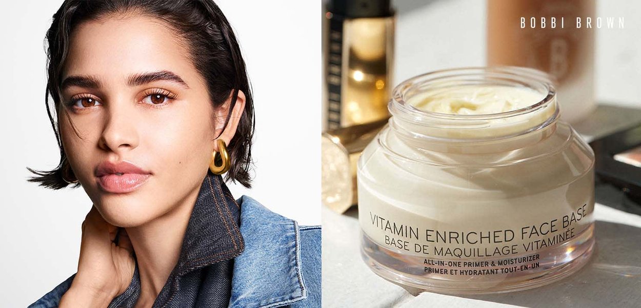 Klart glasskrukke som inneholder et kremaktig produkt merket "Vitamin Beriket Ansiktsbase" med svart tekst, og har en jevn, off-white tekstur.