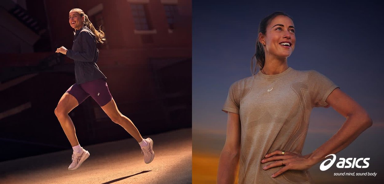 Actieve vrouw in Asics-kledij loopt ’s avonds buiten en glimlacht zelfverzekerd met haar handen in haar zij.