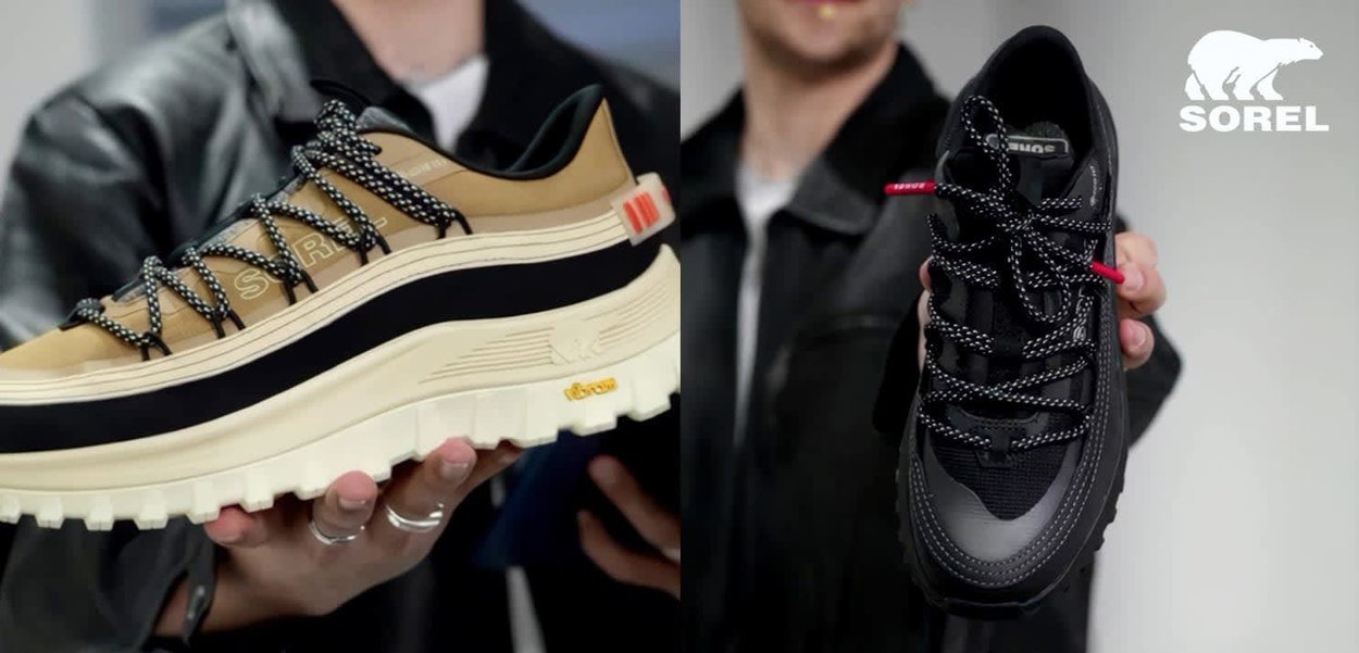 Person hält zwei SOREL-Sneaker nebeneinander, einen in Hellbraun mit schwarzen Akzenten, den anderen in Schwarz mit reflektierenden Details und gemusterten Schnürsenkeln.