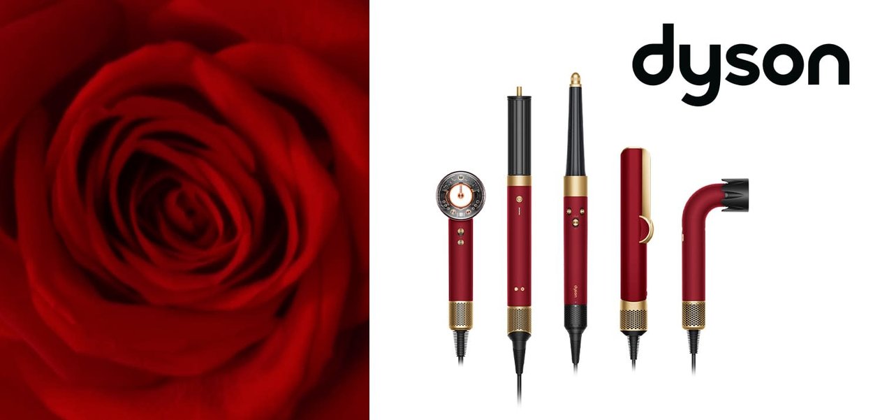 Set per acconciature Dyson rosso e oro con cinque accessori, esposto accanto a un primo piano di una rosa rossa su sfondo bianco.