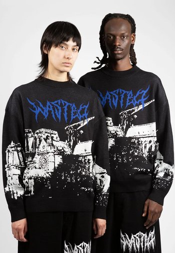 Zwarte gebreide truien met een wit en blauw grafisch ontwerp, waarmee architectonische elementen worden afgebeeld, voorzien van geribde manchetten en zomen.