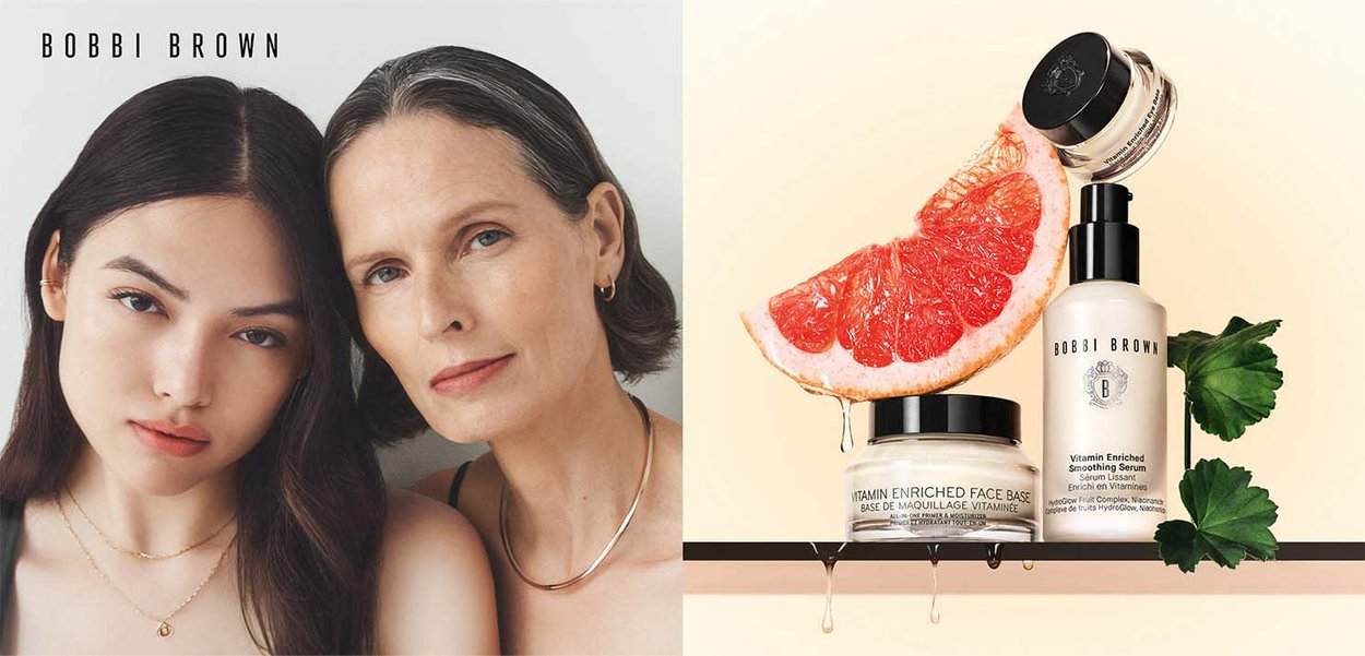 Cosmetics display featuring a clear bottle with a black cap, a jar with a black lid, and a grapefruit slice on a light background.