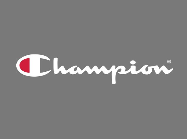 Champions-Logo in weißer Schreibschrift mit einem stilisierten roten "C" auf einem grauen Hintergrund, mit sanften Linien und abgerundeten Kanten.