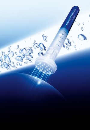 Clear syringe with a blue and white gradient handle, dispensing light beams. Surrounded by water droplets against a blue background.