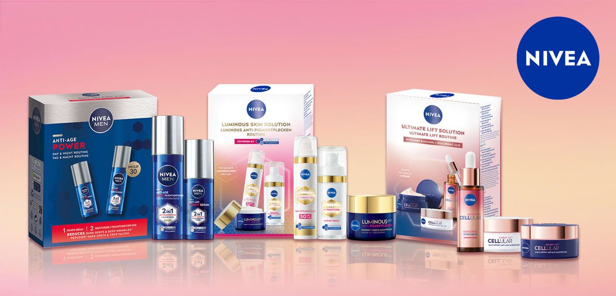 NIVEA skincare products in boxes: blue and white packaging with hexagonal patterns, gold accents, and prominent logos. Includes serums and creams.