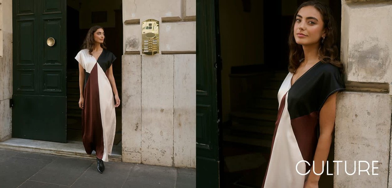 Robe colorée en blocs avec des sections noires, blanches et marron foncé ; manches courtes, col en V, tissu fluide et coupe décontractée.