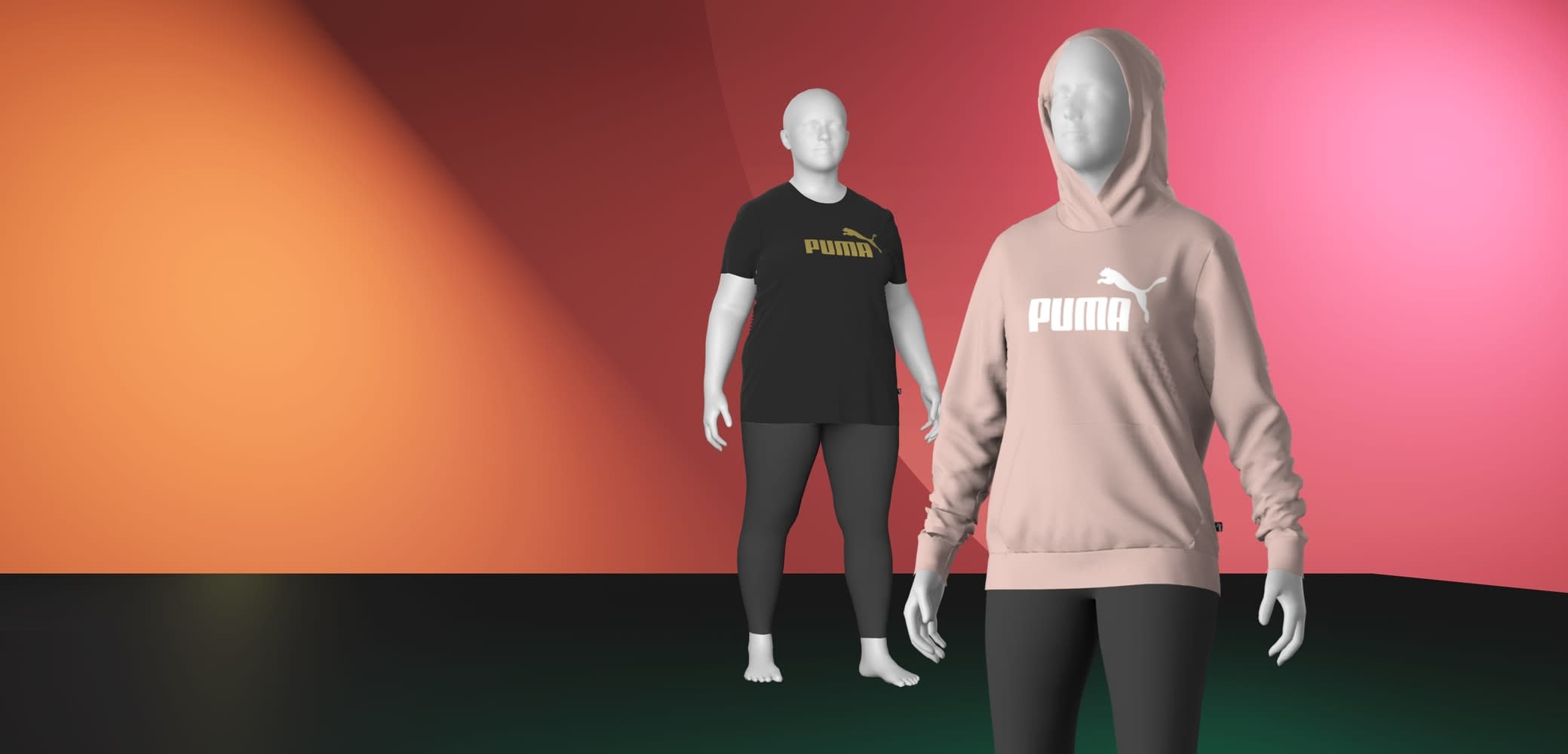 Schwarzes T-Shirt mit goldenem Logo, kombiniert mit einem hellrosa Hoodie mit weißem Logo, beides an Schaufensterpuppen mit schwarzen Leggings getragen.