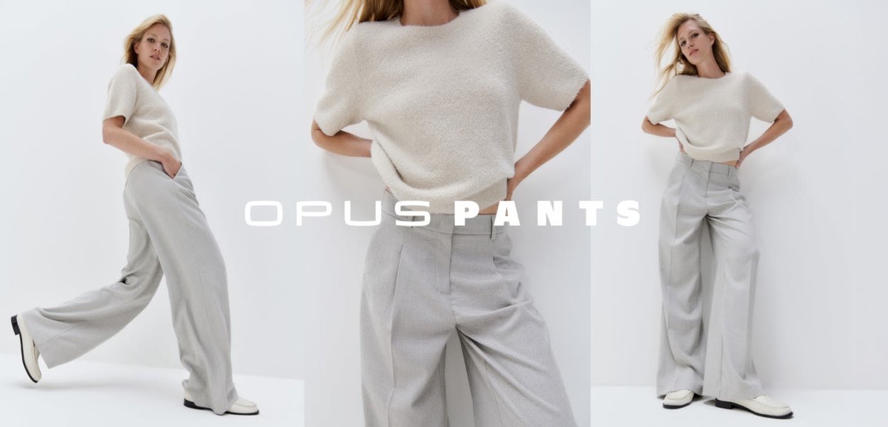 Crème textuur gebreide top gecombineerd met lichtgrijze wijde broekspijpen, met een getailleerde pasvorm en strakke lijnen. Zwart-witte schoenen maken de look compleet.