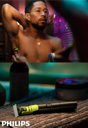 Man scheert oksel met Philips OneBlade trimmer; close-up van de limoengroene en zwarte trimmer op een handdoek met verzorgingsproducten in de buurt.