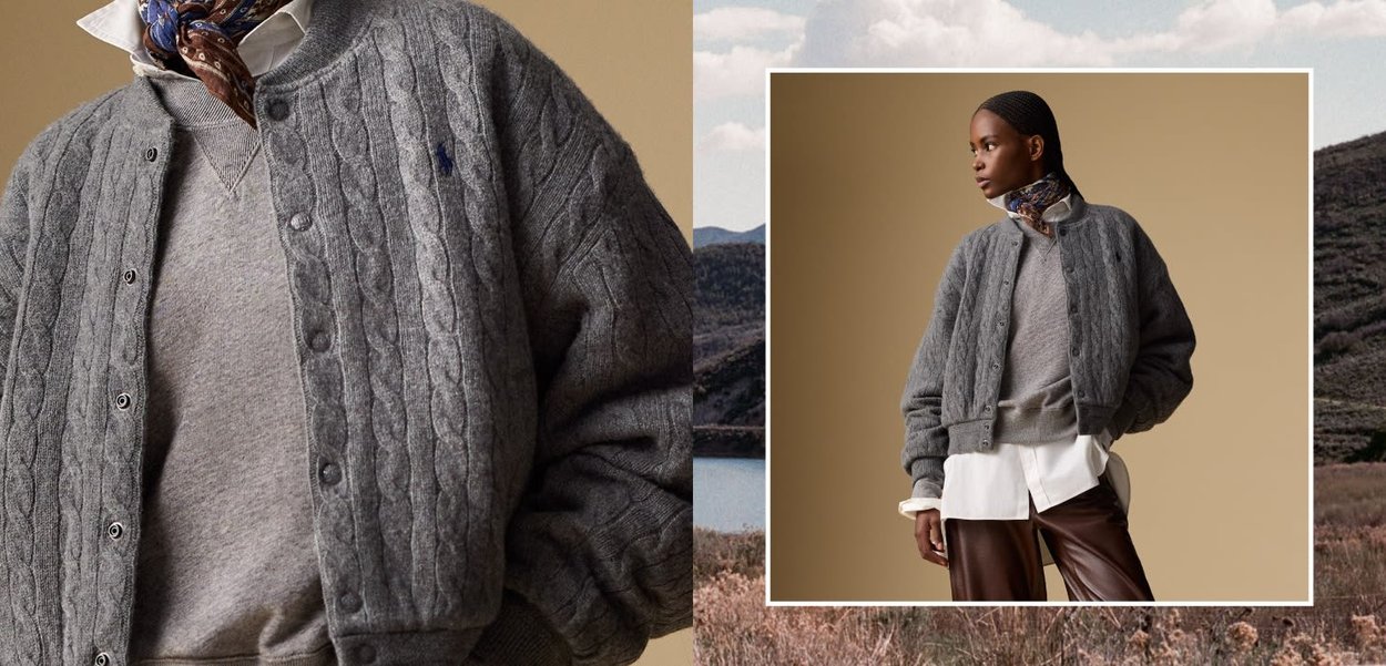 Kvinna som bär en grå kabelstickad cardigan över en grå sweatshirt, en vit skjorta, bruna läderbyxor och en mönstrad halsduk.