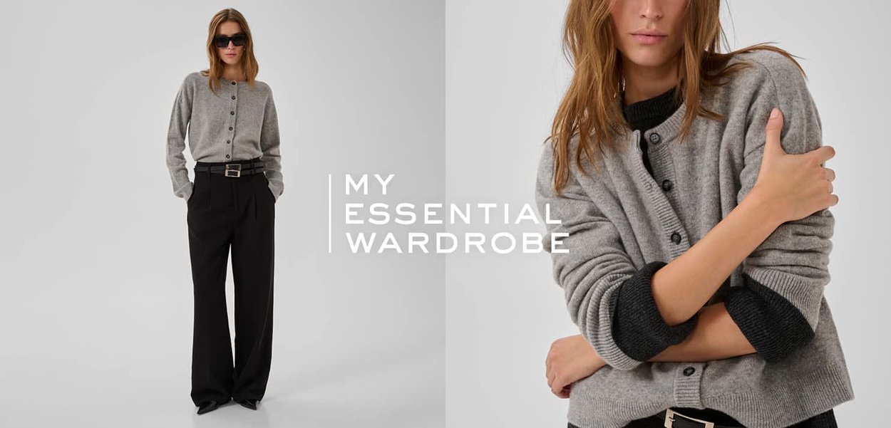 Grauer Cardigan mit Knöpfen, dunkle kontrastierende Bündchen, gerippte Textur, kombiniert mit hoch taillierter schwarzer Hose und einem breiten Gürtel.