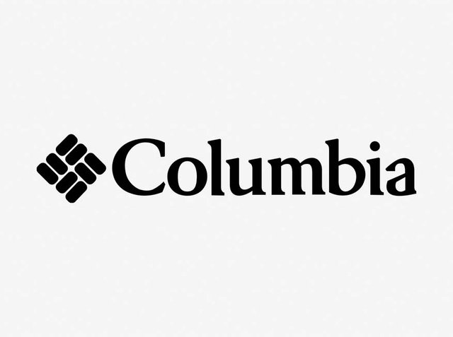 Text negru care afișează "Columbia", însoțit de un logo distinctiv cu un model de diamant de culoare gri închis, pe un fundal gri deschis.