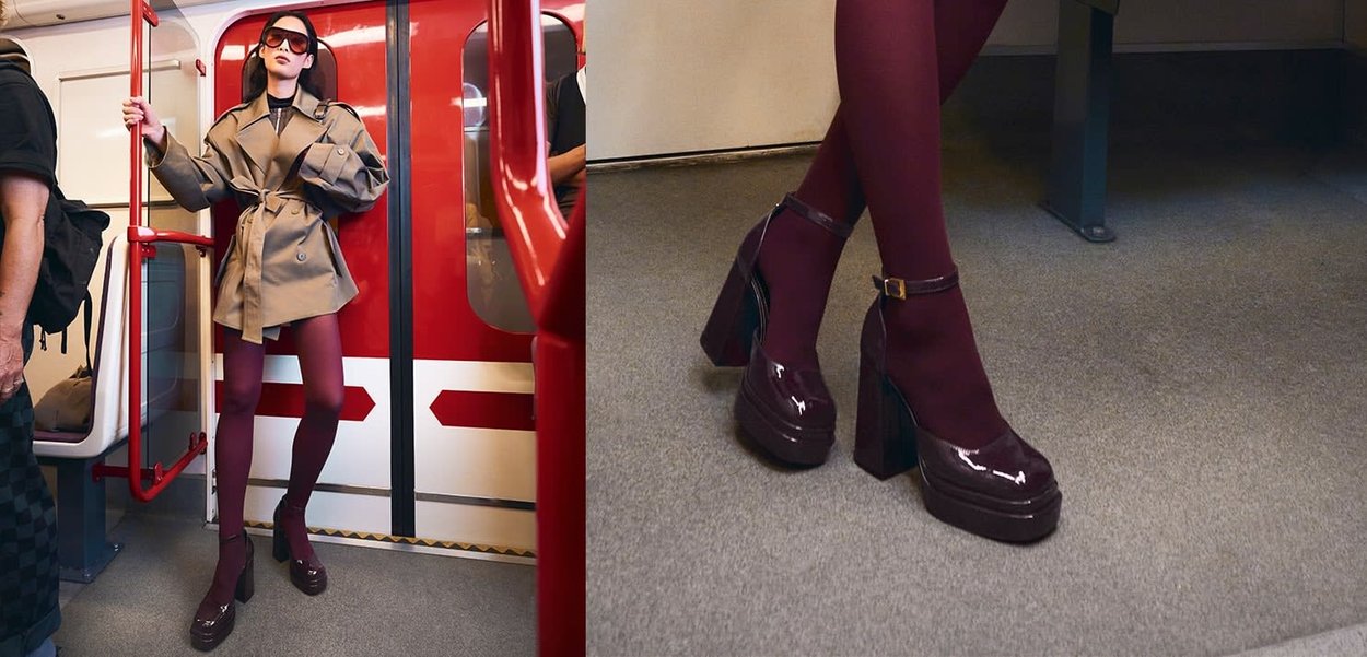 Scarpe platform viola in vernice con tacco spesso e cinturino alla caviglia, abbinate a collant bordeaux, su un pavimento grigio.