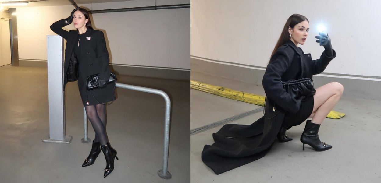 Abrigo negro con acabado texturizado, vestido hasta la rodilla, medias negras transparentes y botas de tacón de aguja. Los accesorios incluyen un bolso negro y guantes.