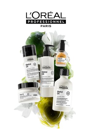L'Oréal Professionnel Metal DX hair care products, featuring white and black bottles with labels, arranged with green plant accents.