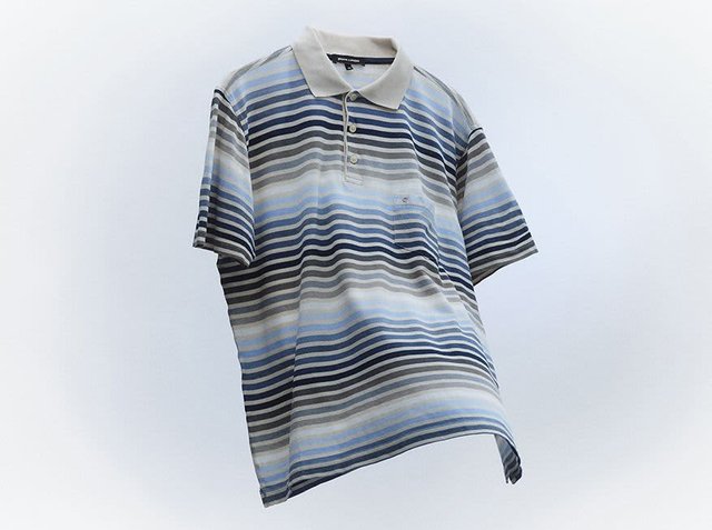 Striped polo shirt in shades of blue, grey, and beige. Features a collar, three-button placket, and short sleeves. Soft fabric texture.
