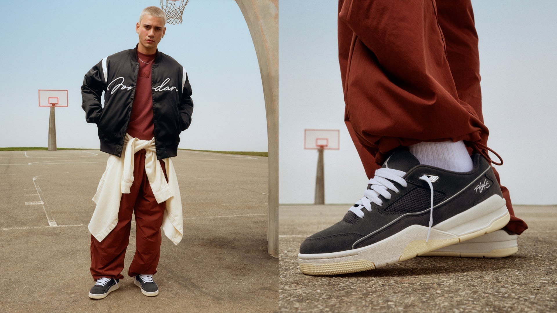 Veste bomber en satin noir avec des accents blancs, chemise rouge, pantalon rouge ample et baskets grises avec semelles blanches et détails en mesh sur un terrain de basket.