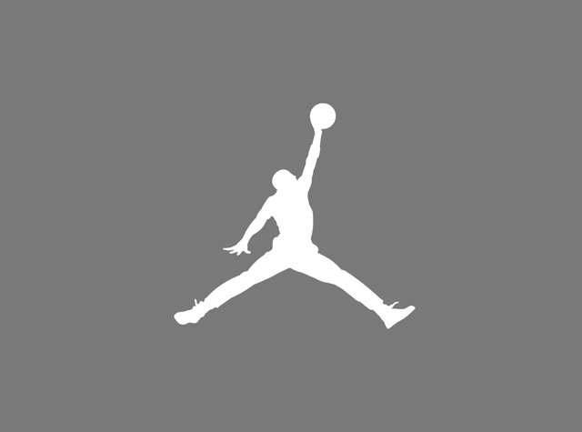 Weiße Silhouette einer Person, die einen Sprung macht, mit einem erhobenen Arm, in dem sie einen Ball hält, vor einem grauen Hintergrund.