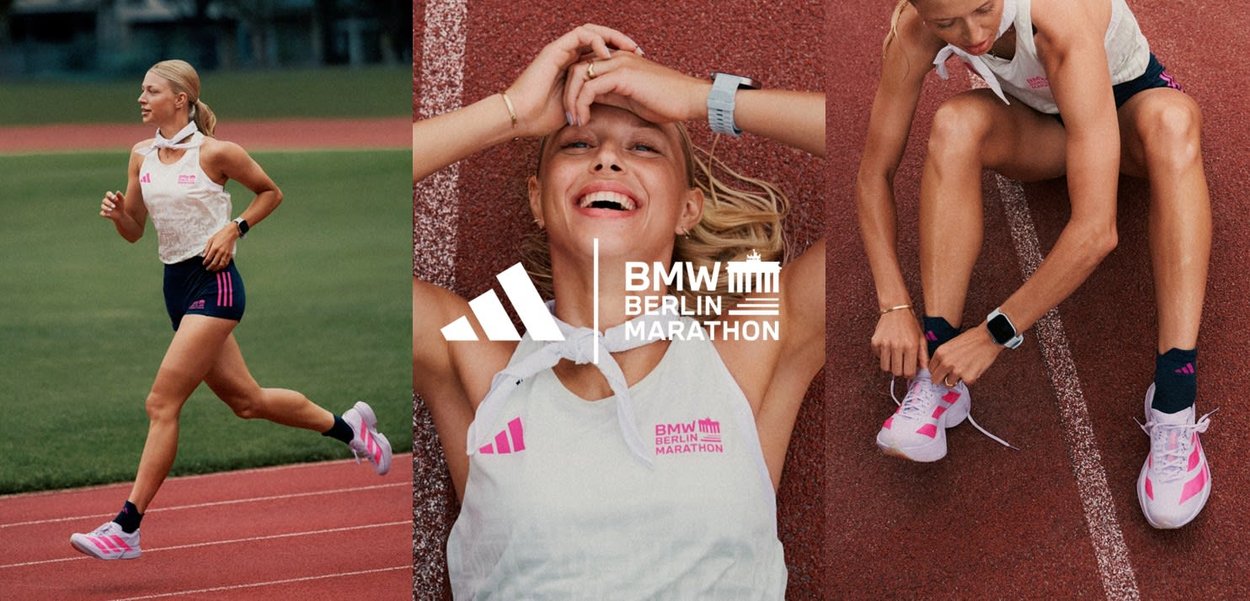 Adidas running outfit with a white top, pink accents, and dark shorts. Light-colored running shoes with pink detailing. Marathon branding visible.