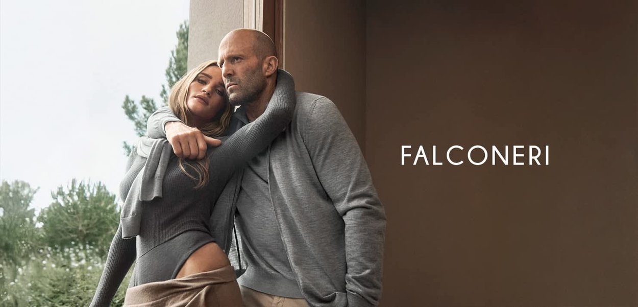Gray-knit sweater and fitted bodycon dress with ruffled accents, posed in a natural setting, featuring a subtle brown background.