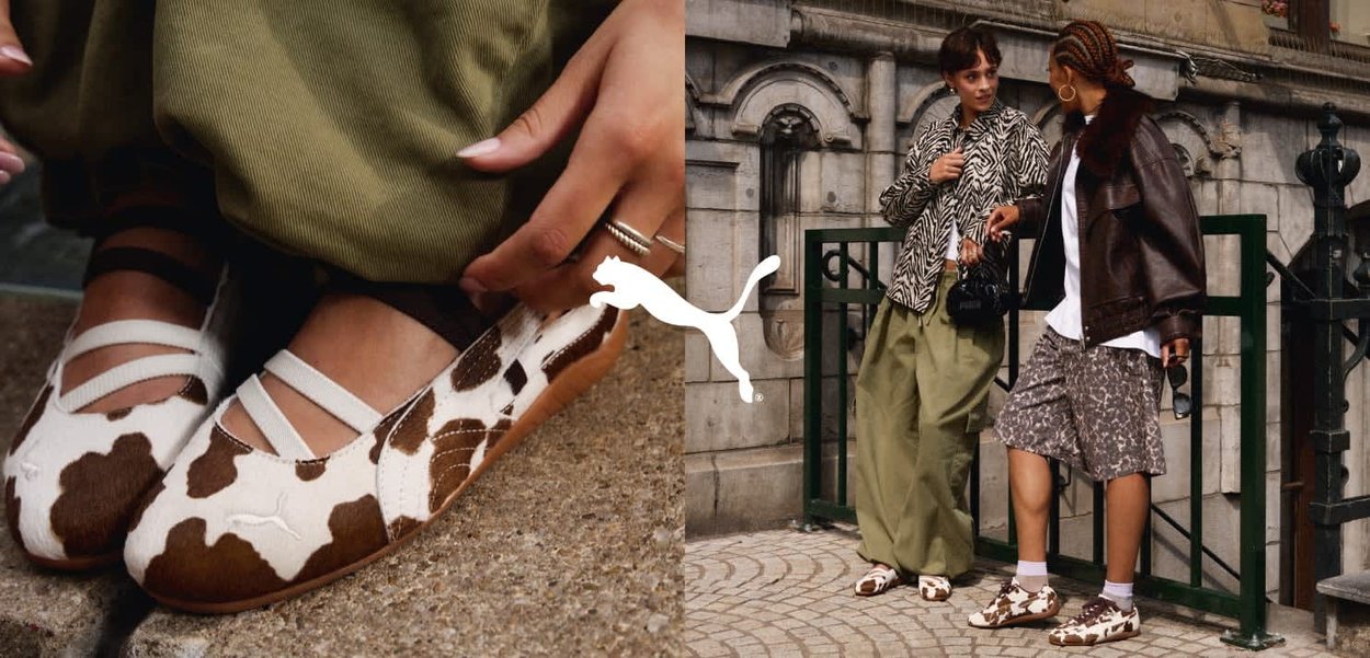 Buty w wzór krowi z miękkim górnym materiałem i paskami, zestawione z codziennymi strojami. Tło miejskie z widoczną dekoracyjną architekturą.