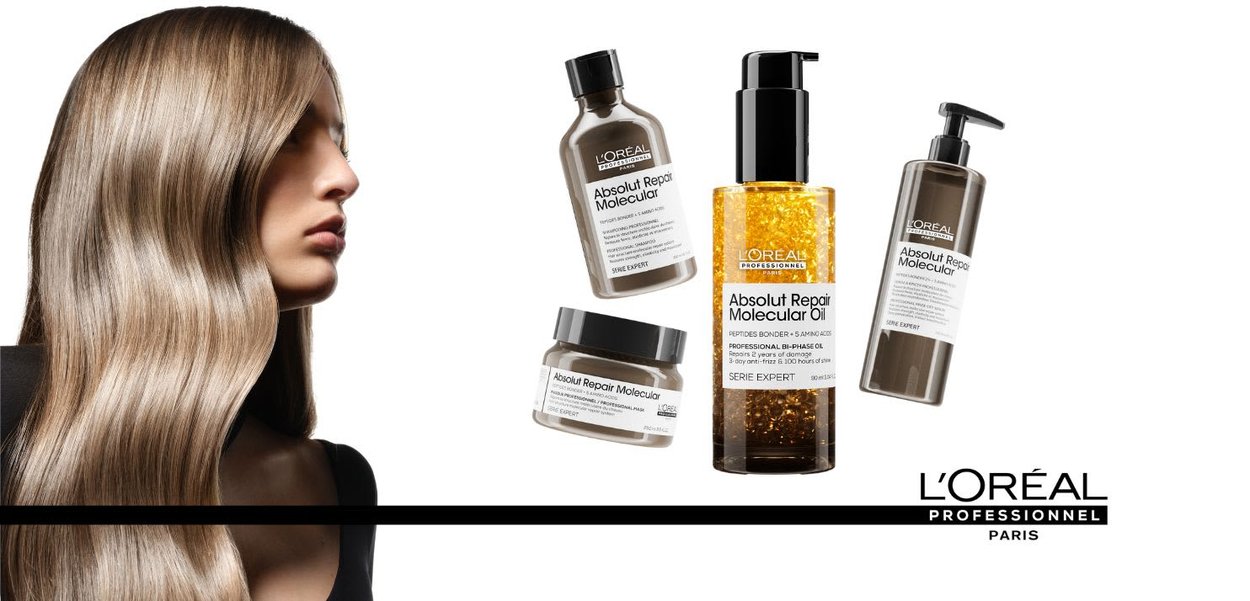 Produits L'Oréal Absolut Repair : quatre flacons aux formes lisses ; contenants bruns avec des bouchons noirs ; un flacon d'huile dorée ; les étiquettes comprennent les détails des produits.