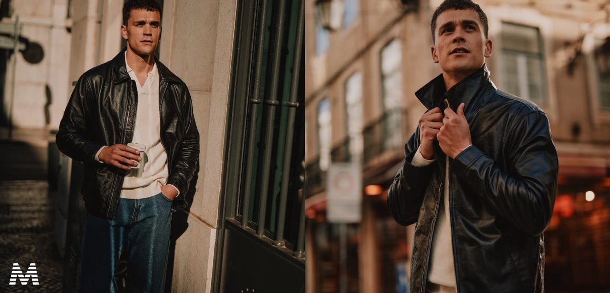 Schwarze Lederjacke mit tailliertem Design und hohem Kragen. Kombiniert mit einem leichten Pullover und Jeans. Kaffeetasse in der Hand.