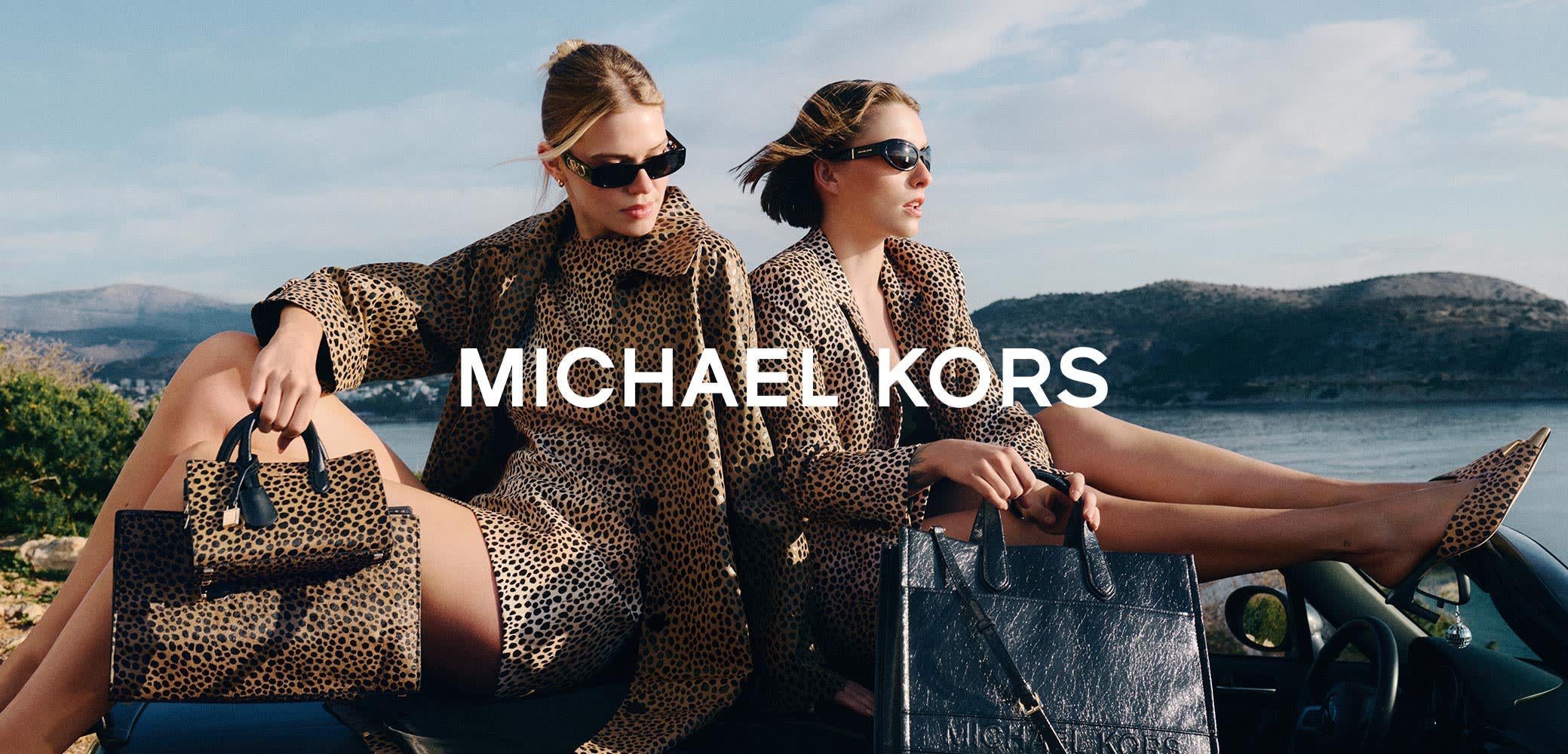 Two women wear leopard print coats and sunglasses, holding a leopard print handbag and a black leather tote with visible hardware accents.