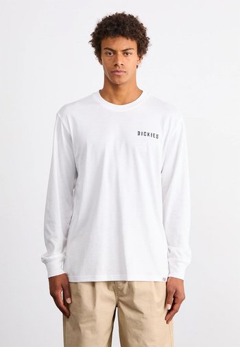 Witte lange mouwen T-shirt van katoen, met een klein zwart "DICKIES" logo op de linkerborst, ronde halslijn en een ontspannen pasvorm.