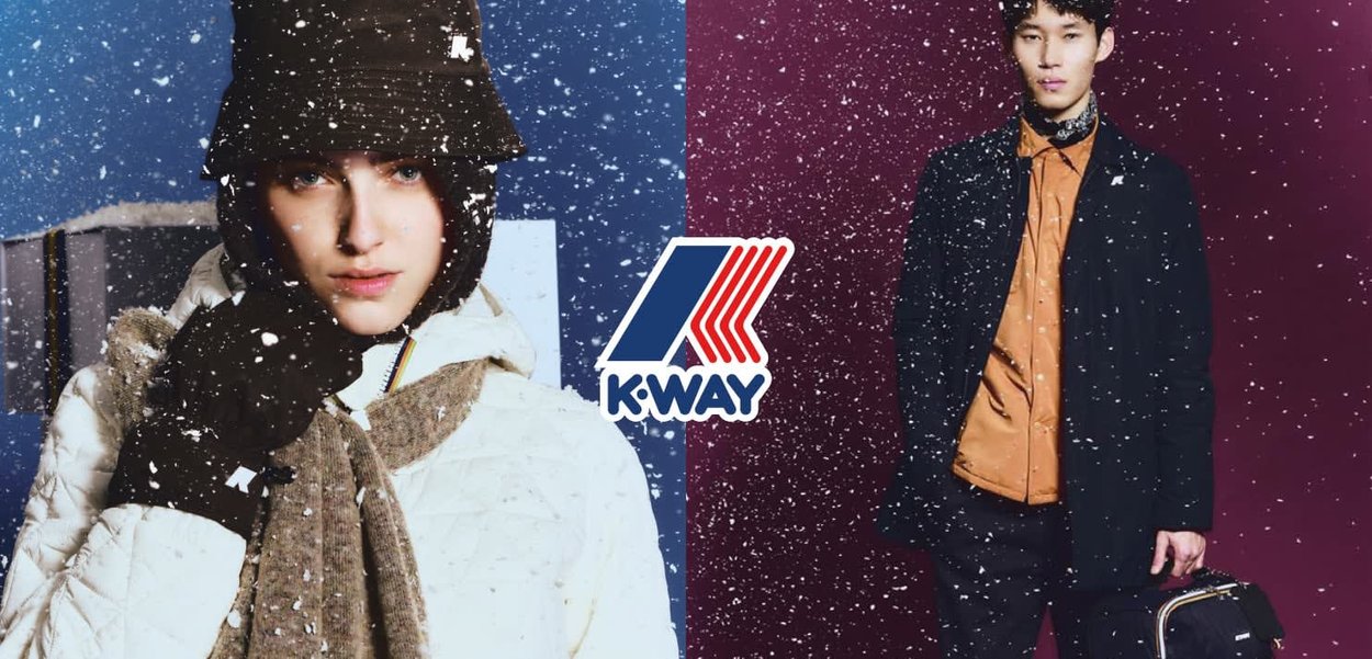 Chaqueta blanca acolchada, guantes marrones y bufanda gris llevados por una modelo entre la nieve que cae. Enfrente, una chaqueta oscura sobre una camisa naranja y un bolso.