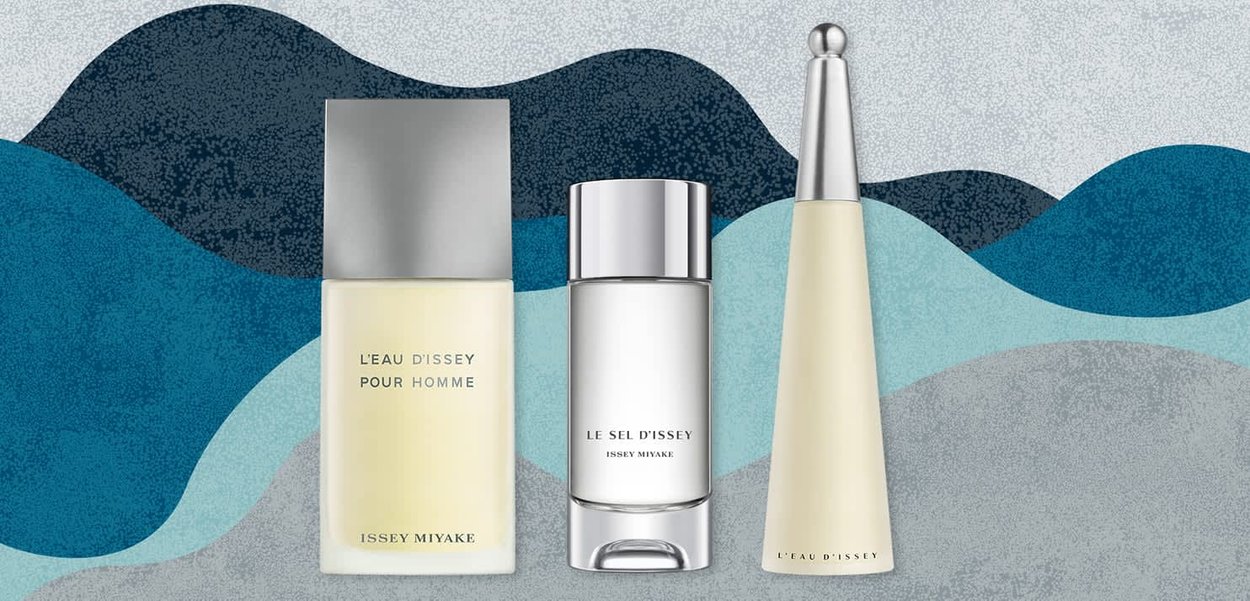 Tre parfume flasker: en med en sølvkapsel og gul væske, en klar med en sølv detalje og en anden slank med et hvidt og gyldent design.