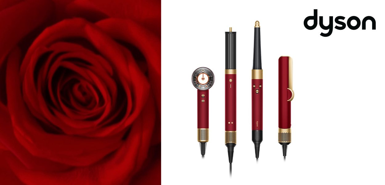 Dyson- Haarstyling-Tools in Rot und Gold, darunter ein Haartrockner, ein Lockenstab und ein Glätteisen, vor einem roten Rosenhintergrund mit Dyson-Logo.