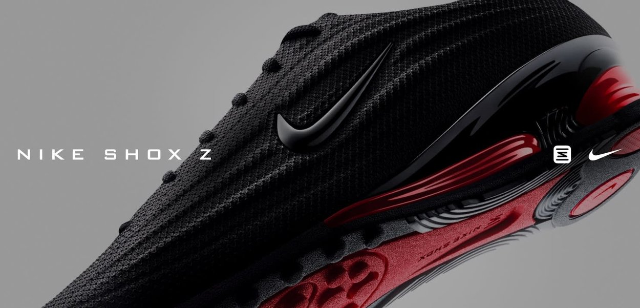 Sneaker Nike Shox Z con tomaia nera testurizzata, design elegante, suola ammortizzata rossa e nera, e un logo prominente sul lato.