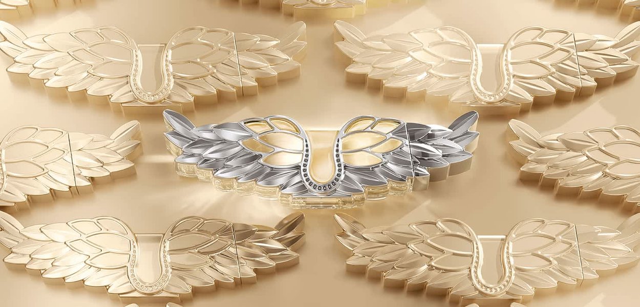 Zwanenvormige broches in goud en zilver, met verfijnde details, getextureerde vleugels en een centraal ontwerp met kleine edelstenen.