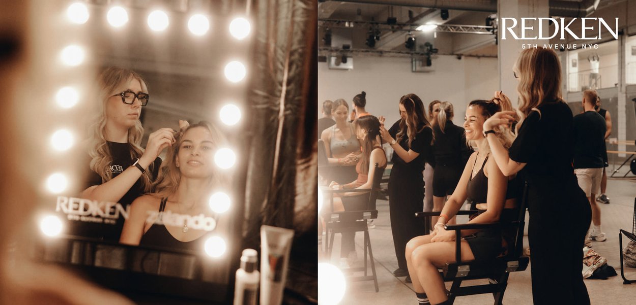 Two braided hairstyles in focus, featuring brown hair. A stylist applies product from a spray can, with reflections and soft lighting in background.