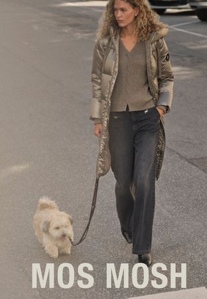 Silver puffer coat with a hood, textured grey sweater, dark denim jeans, and black boots; walking a small light-colored dog on a leash.