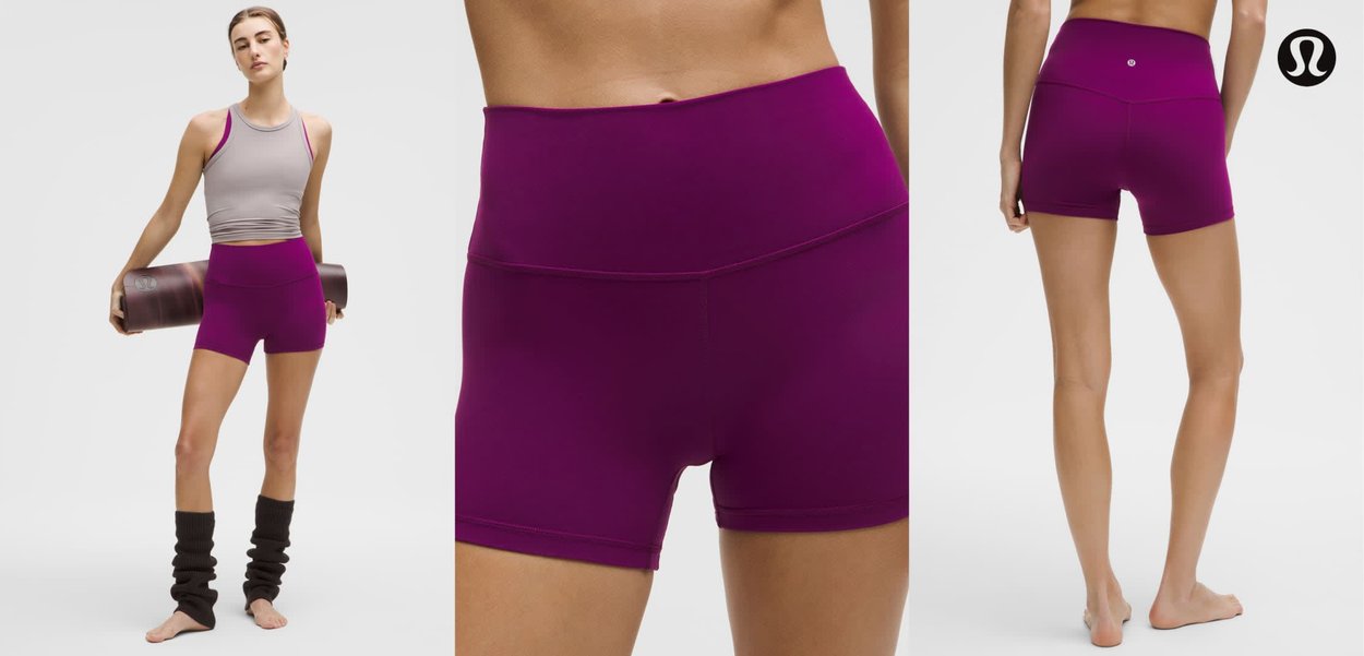 Violetti urheilushortsit, joissa leveä vyötärönauha, joustava kangas ja sileä pinta. Täydennetty harmaalla topilla ja sääriosilla.