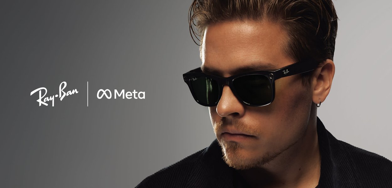 Ray-Ban sunglasses with black plastic frames and dark green lenses. Features include metal accents and a sleek design. Logo visible.