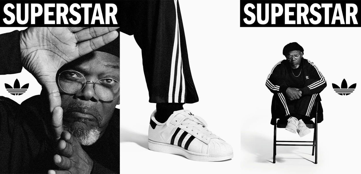 Adidas Superstar sneakers in white with black stripes and a shell toe, paired with black athletic pants featuring white side stripes.
